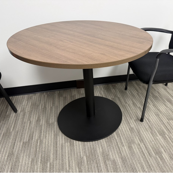 Round Table with Black Disc Base round table in walnut with black disc base